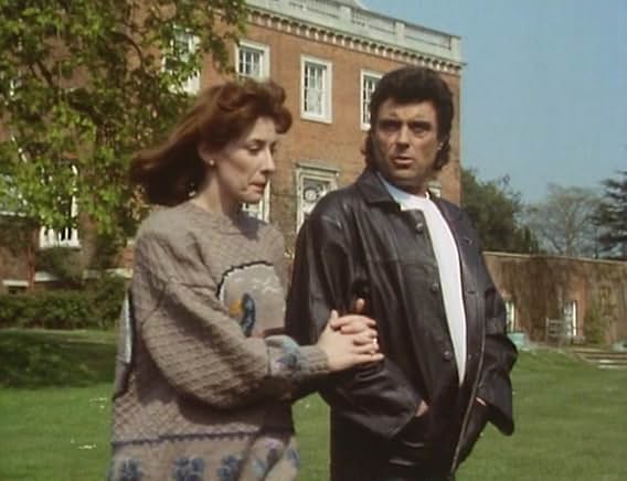 Lady Jane, in the duck jumper, walking arm in arm with Lovejoy outside a red-brick country house